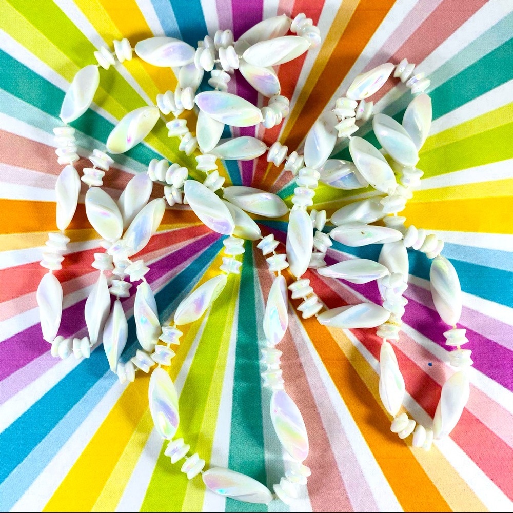 58” strand of iridescent plastic multi shaped beads Hong Kong Vintage